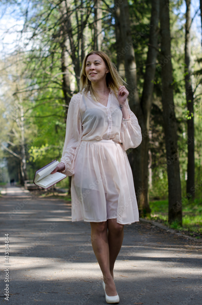 young girl in a dress in the park