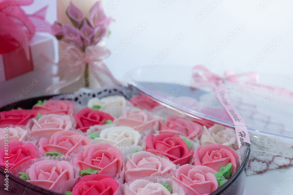 Close up of rose shaped dessert in heart shape box for Valentine's day, selective focus, presents for Valentine's day Close up of rose shaped dessert in heart shape box for Valentine's day, selective focus, presents for Valentine's day