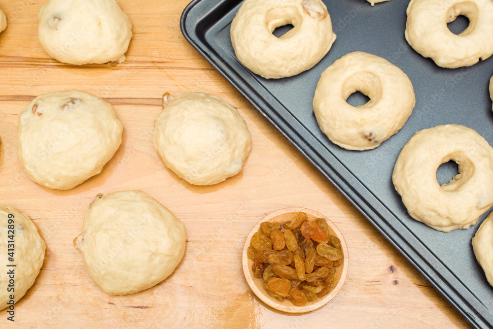 Homemade baking. The process of making buns (donuts) and raisins. Dough for buns (pies)
