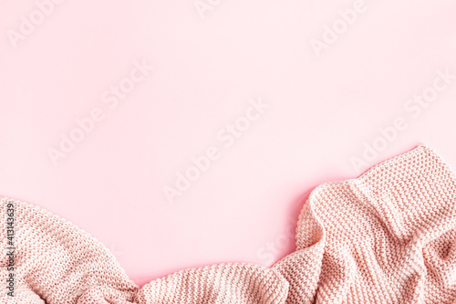 Pink blanket on pink background. Flat lay, top view