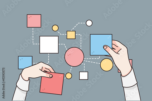 Business strategy, planing, processes concept. Hands of businessman changing papers business steps for making one strategy for development over grey table background, top view 