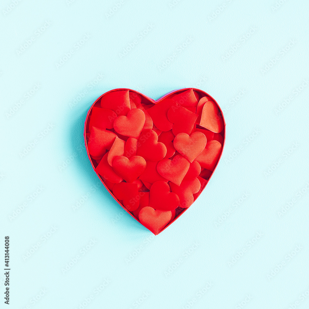 Valentine's Day background. Gift, hearts on blue background. Valentines day concept. Flat lay, top view