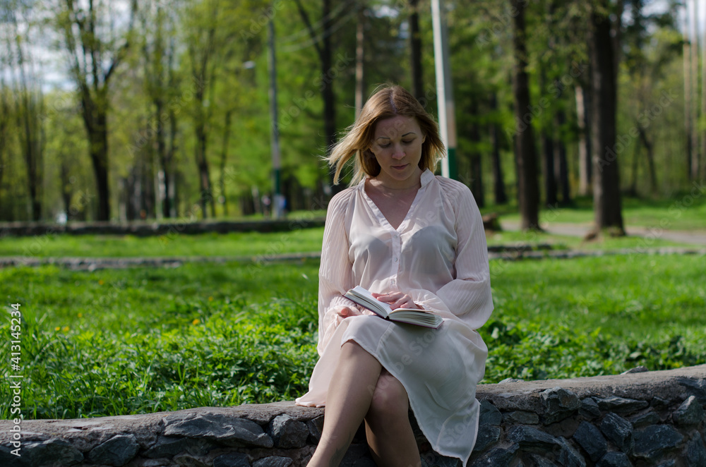young girl in a dress in the park young girl in a dress in the park