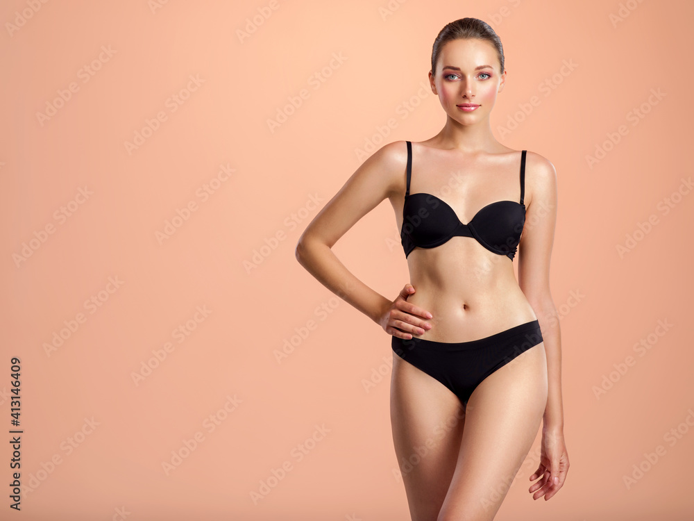 Obraz premium Young woman with a beautiful and healthy body. Sexy woman with a perfect body.