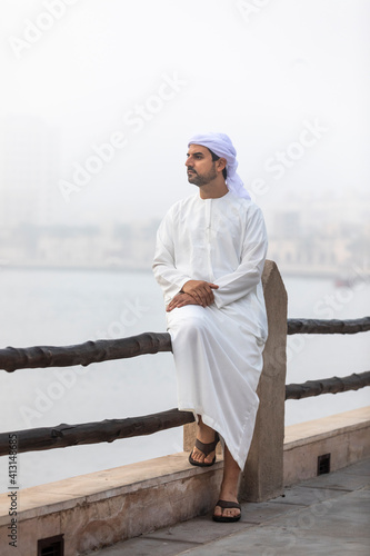 arab man in Dubai in a foggy morning