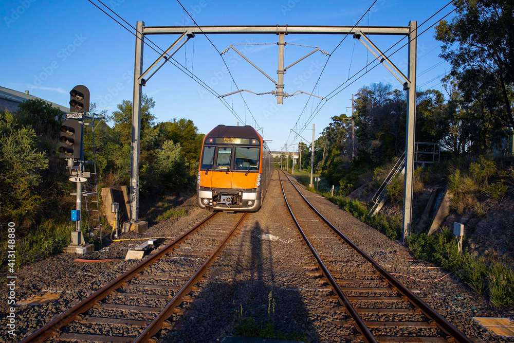 Fototapeta premium Commuter Train fast moving through a Station in Sydney NSW Australia