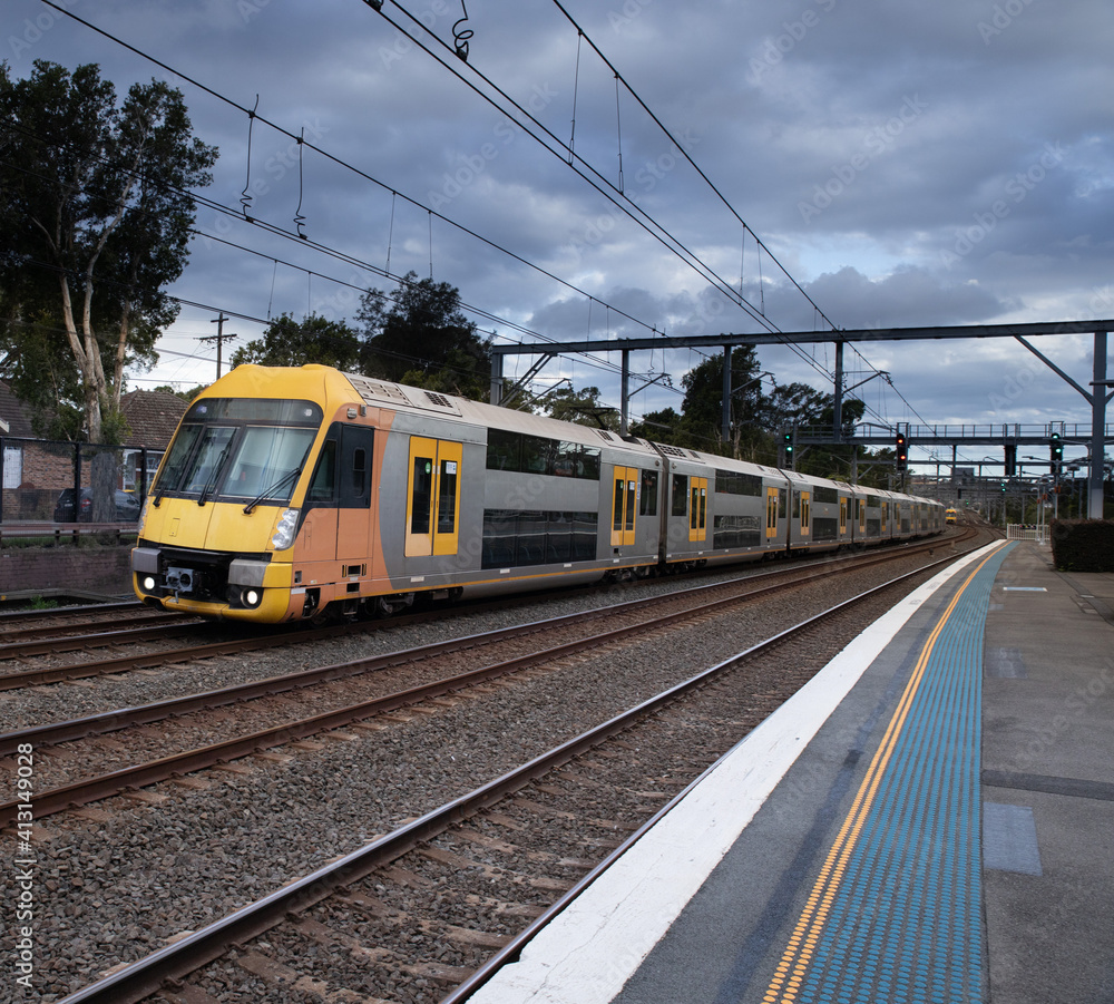 Commuter Train fast moving through a Station in Sydney NSW Australia Commuter Train fast moving through a Station in Sydney NSW Australia