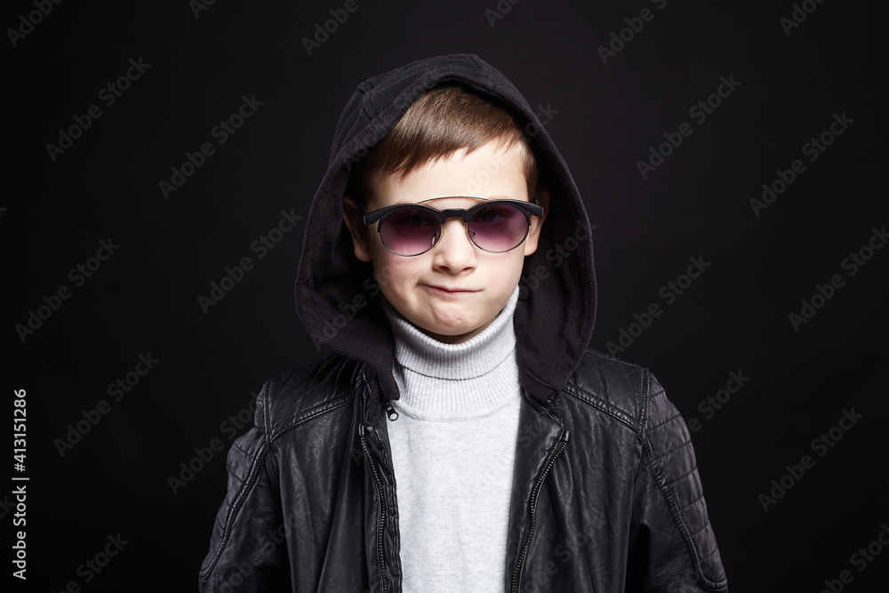 funny little boy in hoodie and sunglasses funny little boy in hoodie and sunglasses
