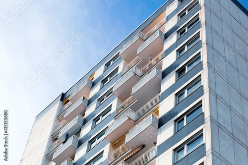 Facade of city apartments. Urban apartment complex. Detail of the facade of a multi story residential building. Apartment house, old architecture, residential building. Germany, Mainz, Rhineland 