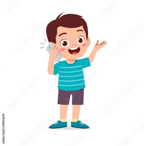 cute little boy talk using mobile phone