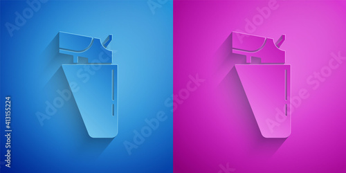 Paper cut Revolver gun in holster icon isolated on blue and purple background. Paper art style. Vector.