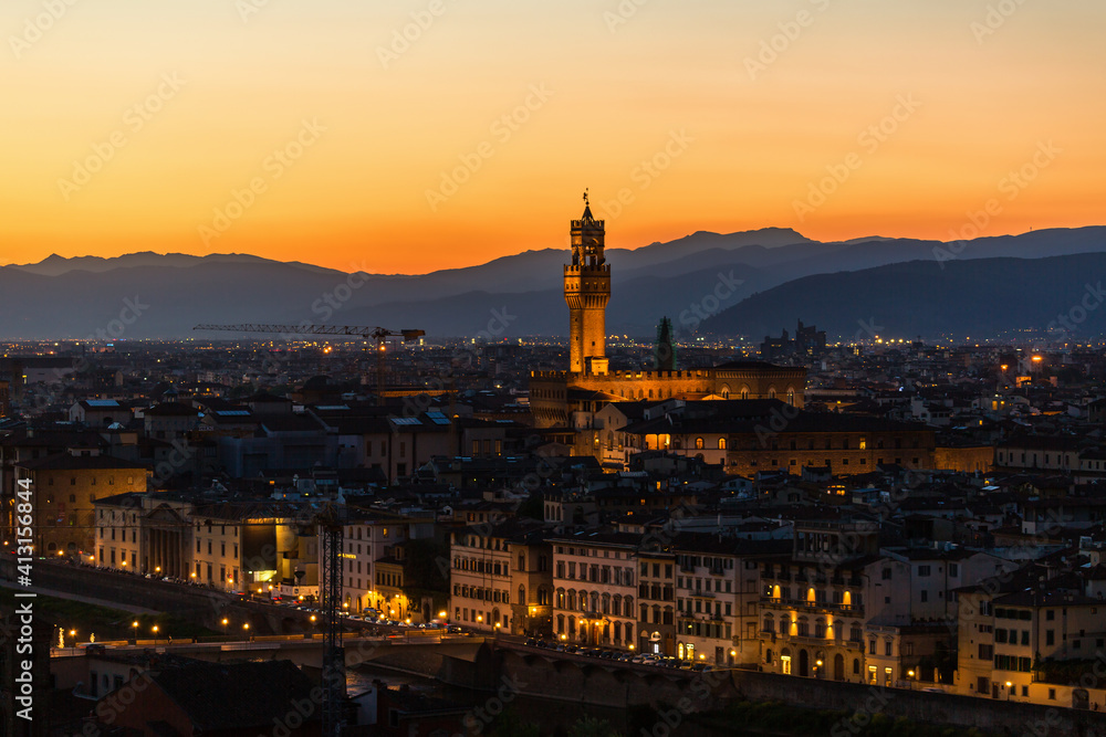 Cityscape of Florence at sunset with mountains