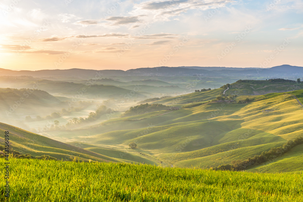 Fototapeta premium Dawn with fog in the valley in Tuscany