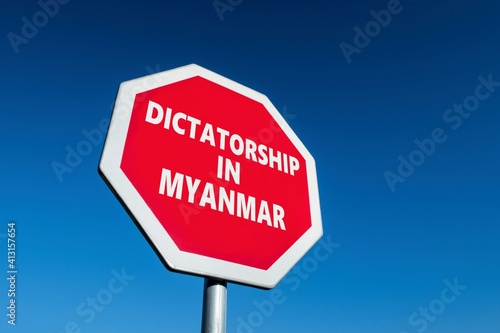 Stop sign with DICTATORSHIP IN MYANMAR text to change the results of military coup in the country photo