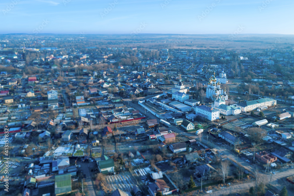 Tilt-shift aerial view of the town and St. Nicolas monastery (Nikolsky monastery) at sunny winter day. Pereslavl-Zalessky, Yaroslavl Oblast, Russia.