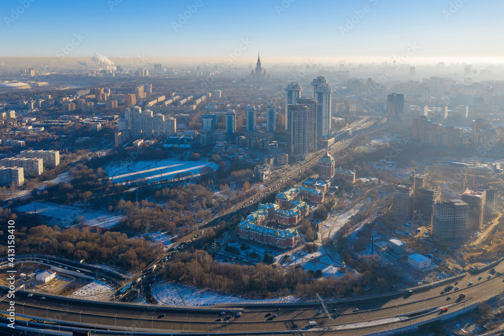 Contre-jour aerial view of Moscow (Ramenki district) at sunny winter day. Russia.