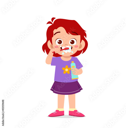 cute little girl brushing teeth and holding toothpaste