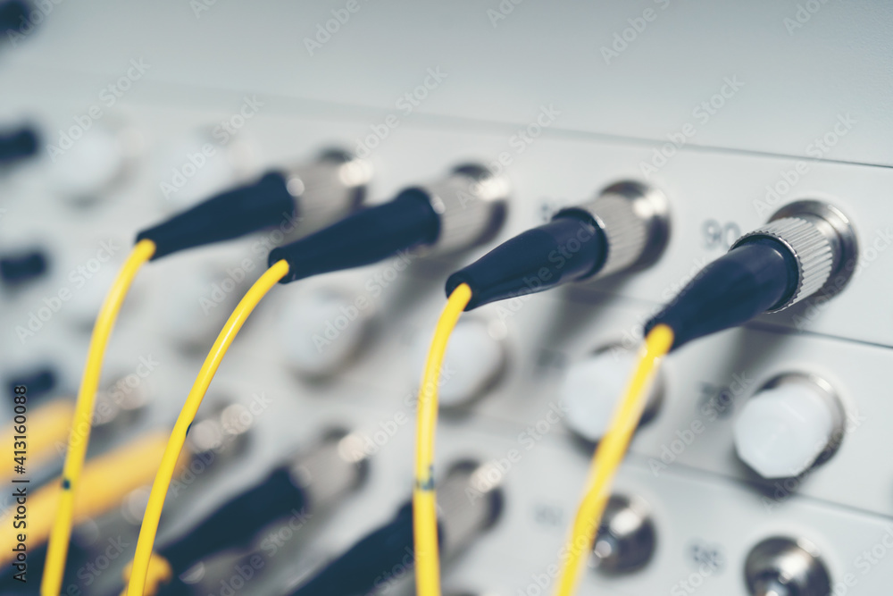 Fiber Optic cables connected to an optic ports and Network cable system Fiber Optic cables connected to an optic ports and Network cable system