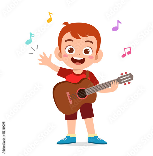 cute little boy play guitar in concert