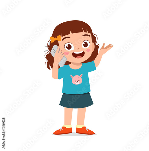 cute little girl talk using mobile phone