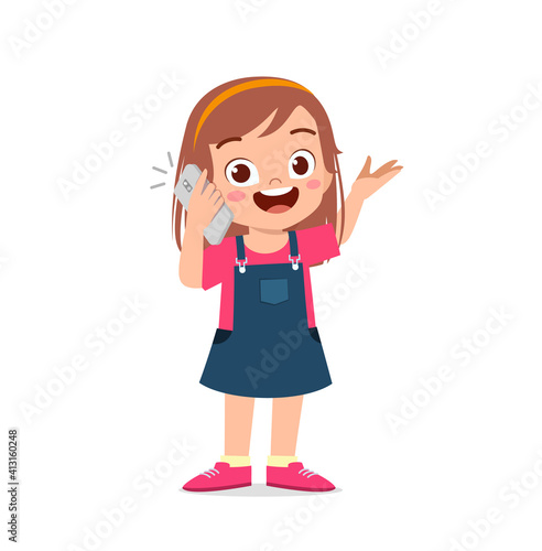 cute little girl talk using mobile phone