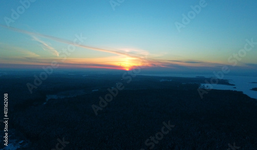 Top view of sunset over winter black forest © Payllik