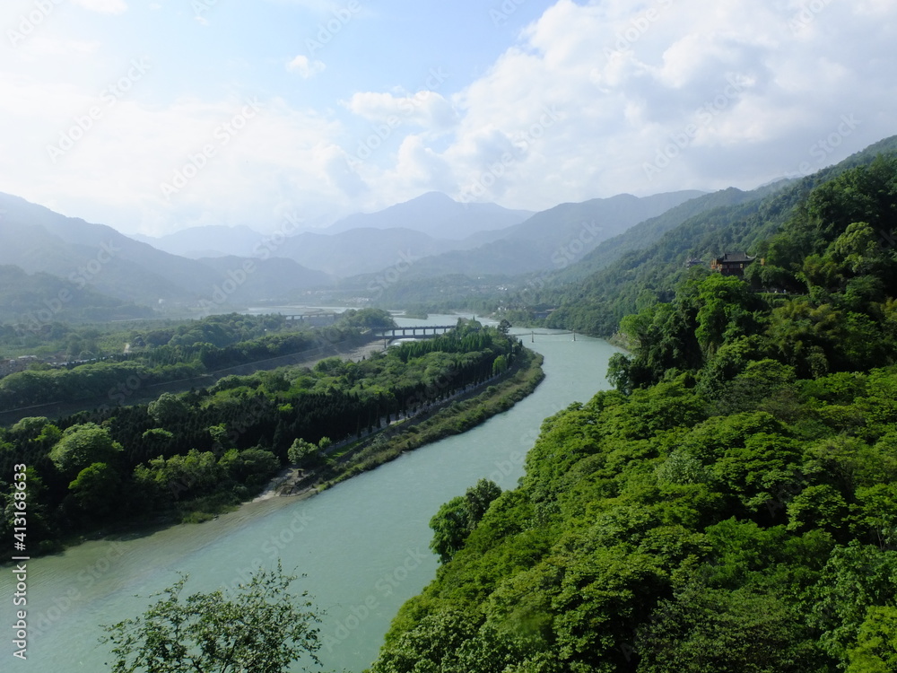 Panoramic view of the Min river winding through the rolling hills of Dujiangyan, Sichuan, China