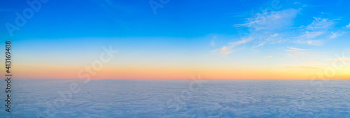 Dawn or sunset over the clouds, blue hour, aerial view. © maykal