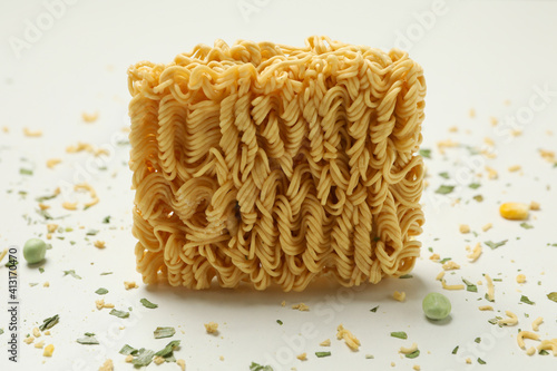 Instant noodles and spices on white background