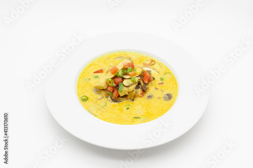 Low carb Curry soup with chicken, coconut milk, champignons, and chilli pepper