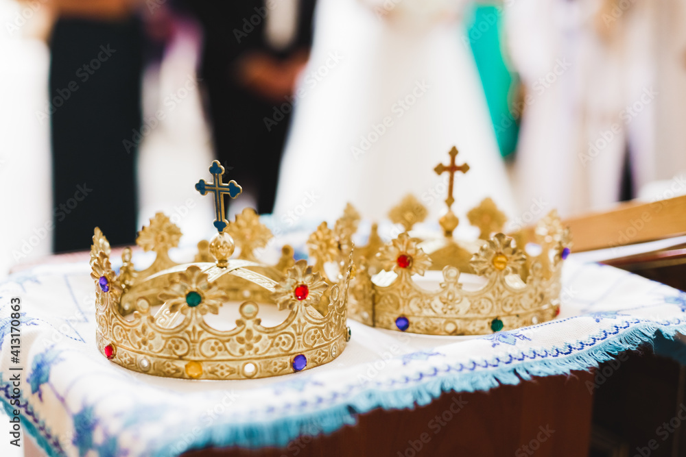 Golden crowns lying on the table in church Golden crowns lying on the table in church