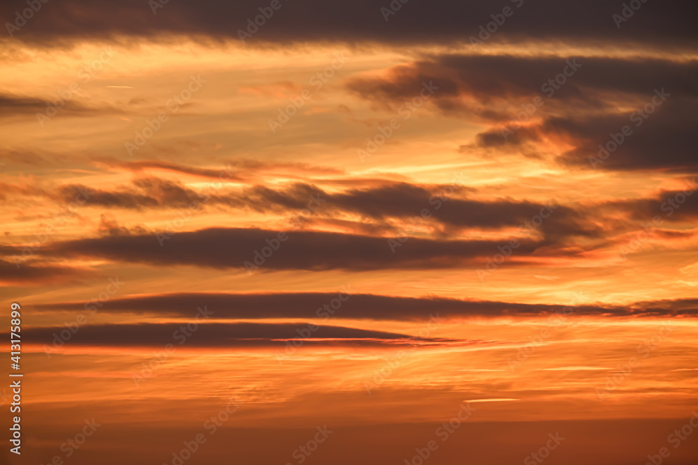 Red dramatic sunset  beautiful sky red cloud  golden light of the sun background