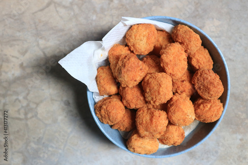 fried chicken pop nuggets in a cup.