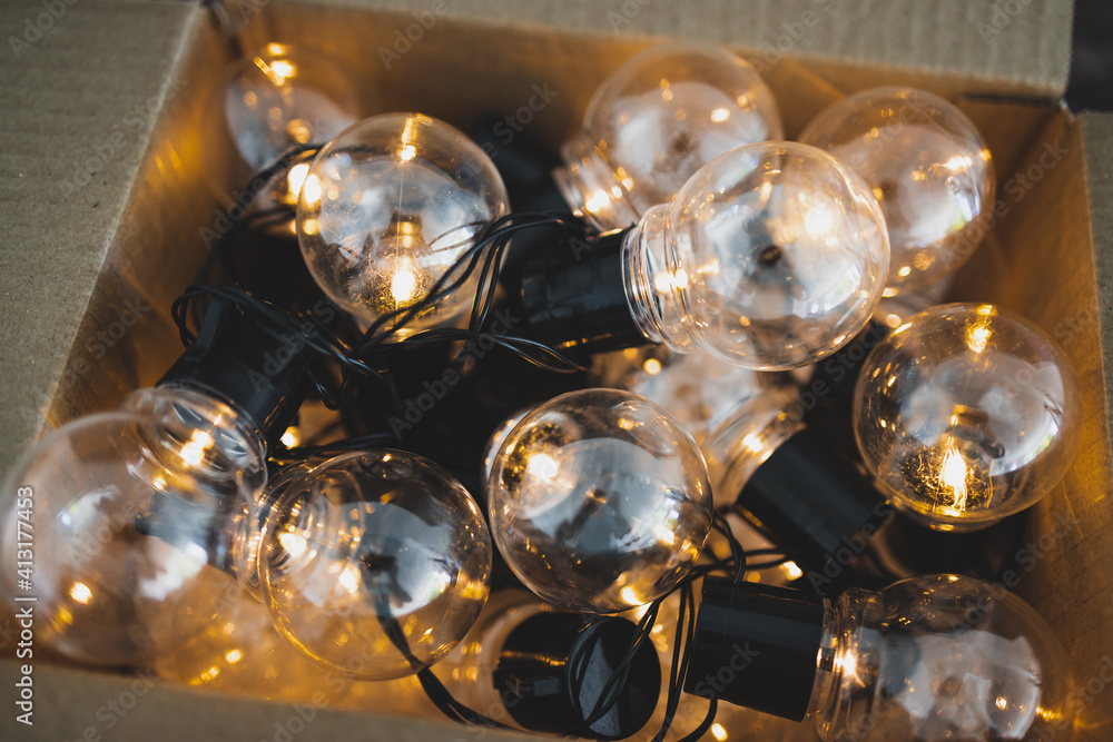 group of light bulbs shining from an open box, mindset and thinking outside the box group of light bulbs shining from an open box, mindset and thinking outside the box