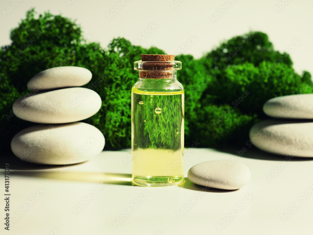 Cosmetic essential oil in glass bottles on beige background closeup. Stone podium, moss, tree bark, green leaves. Trendy natural beauty concept. Aroma spa packaging clipart Cosmetic essential oil in glass bottles on beige background closeup. Stone podium, moss, tree bark, green leaves. Trendy natural beauty concept. Aroma spa packaging clipart