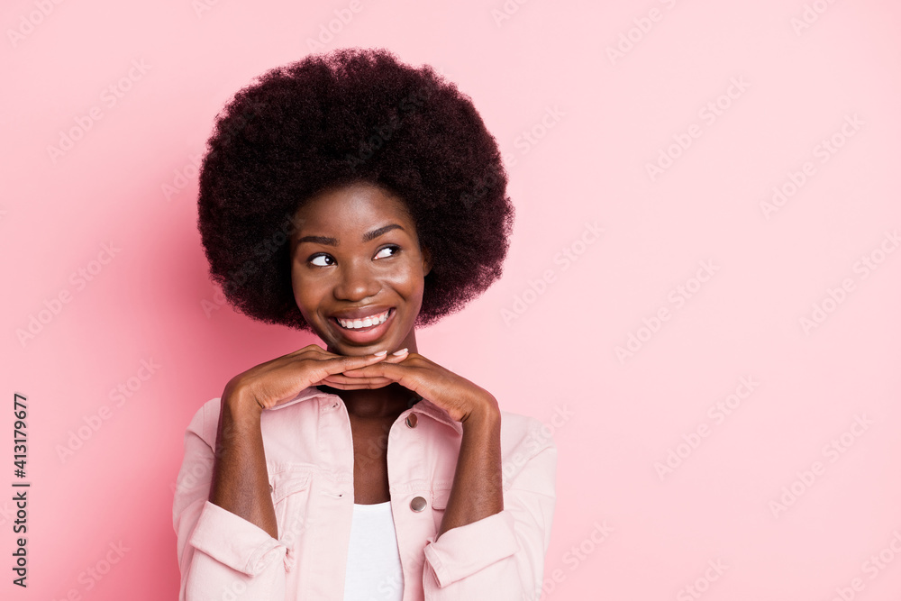 Close-up portrait of pretty cheerful creative minded wavy-haired girl looking aside copy space isolated over pink pastel color background Close-up portrait of pretty cheerful creative minded wavy-haired girl looking aside copy space isolated over pink pastel color background