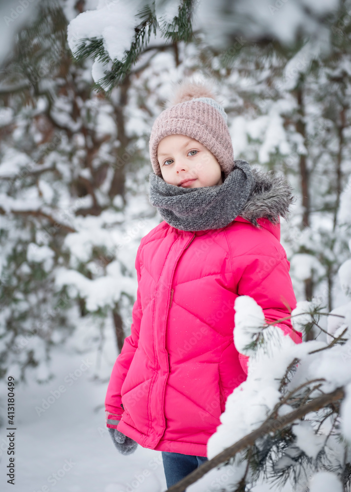 Child in winter. A little girl,  playing in the winter outside.