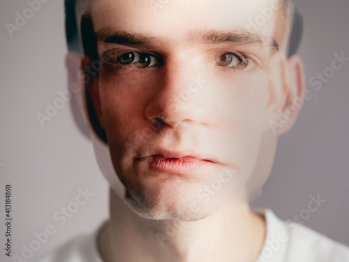 portrait of a young man, a guy out of focus. Multiple personality disorder, bipolar disorder, neurosis, panic attack