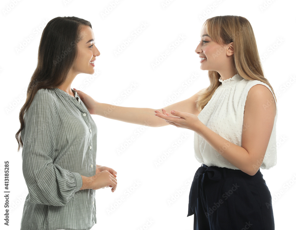 Young women in casual clothes talking on white background Young women in casual clothes talking on white background