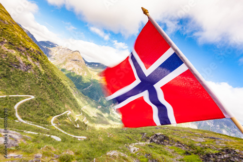 Norwegian flag and mountains valley