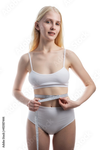 Woman measuring perfect shape of beautiful waist. Healthy lifestyle concept