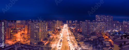 Night avenue, drone view, illuminated city streets.