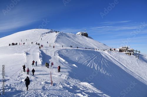 Obraz na płótnie Kasprowy Wierch mountain, winter in the Tatras, tourists and skiers w salonie