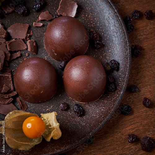 Chocolate truffles on a plate.