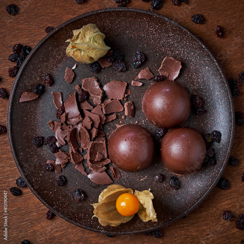 Chocolate truffles on a plate.