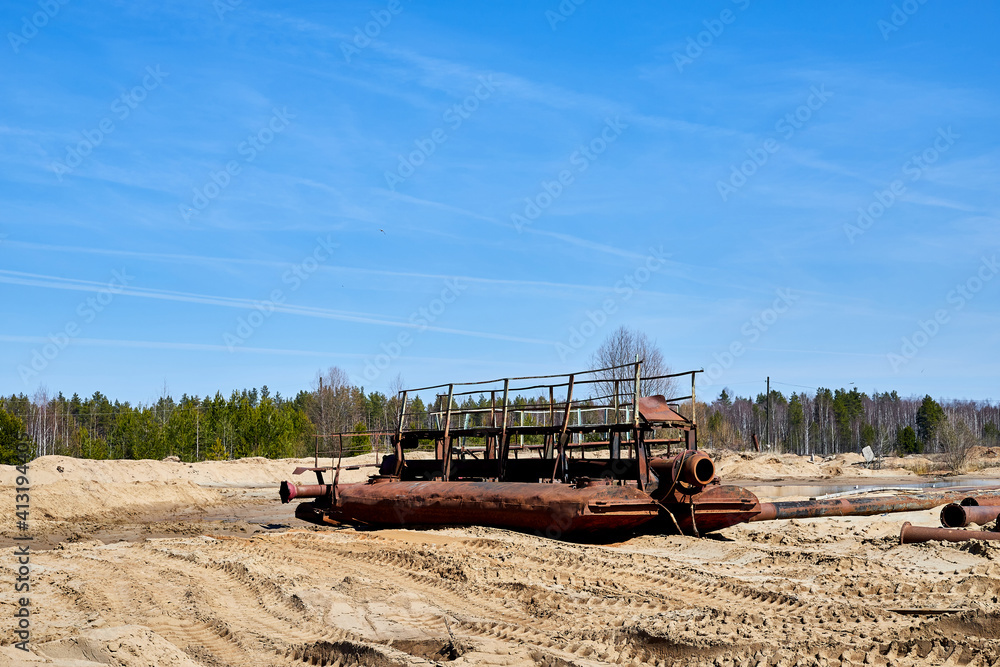 Fototapeta premium Old ship in the desert in the sand on sunny summer day and blue sky on the background