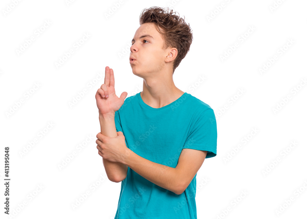 Handsome teen boy pointing hand and fingers to head like gun, suicide gesture, isolated on white background