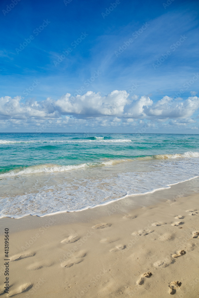 Beach in Latin America. Vacation in Cuba. Green water. Aquamarine Ocean. Footprints on the beach Beach in Latin America. Vacation in Cuba. Green water. Aquamarine Ocean. Footprints on the beach
