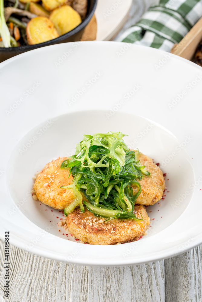 Several chickpea cutlets on a white round plate filmed in decor Several chickpea cutlets on a white round plate filmed in decor