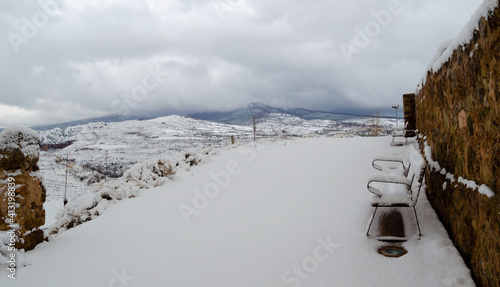 bench with snow and mountains  incredible views